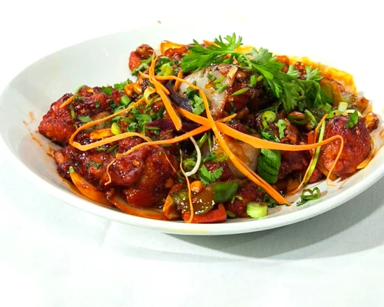 Indo-Chinese chilli chicken with peppers and onions