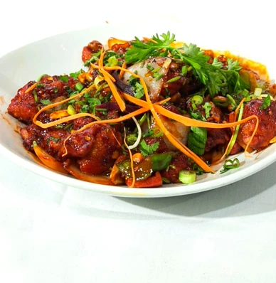 Indo-Chinese chilli chicken with peppers and onions