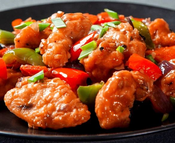 Chicken Manchurian with peppers, onions and scallions