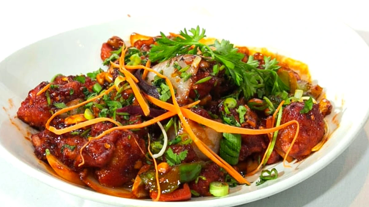 Indo-Chinese chilli chicken with peppers and onions